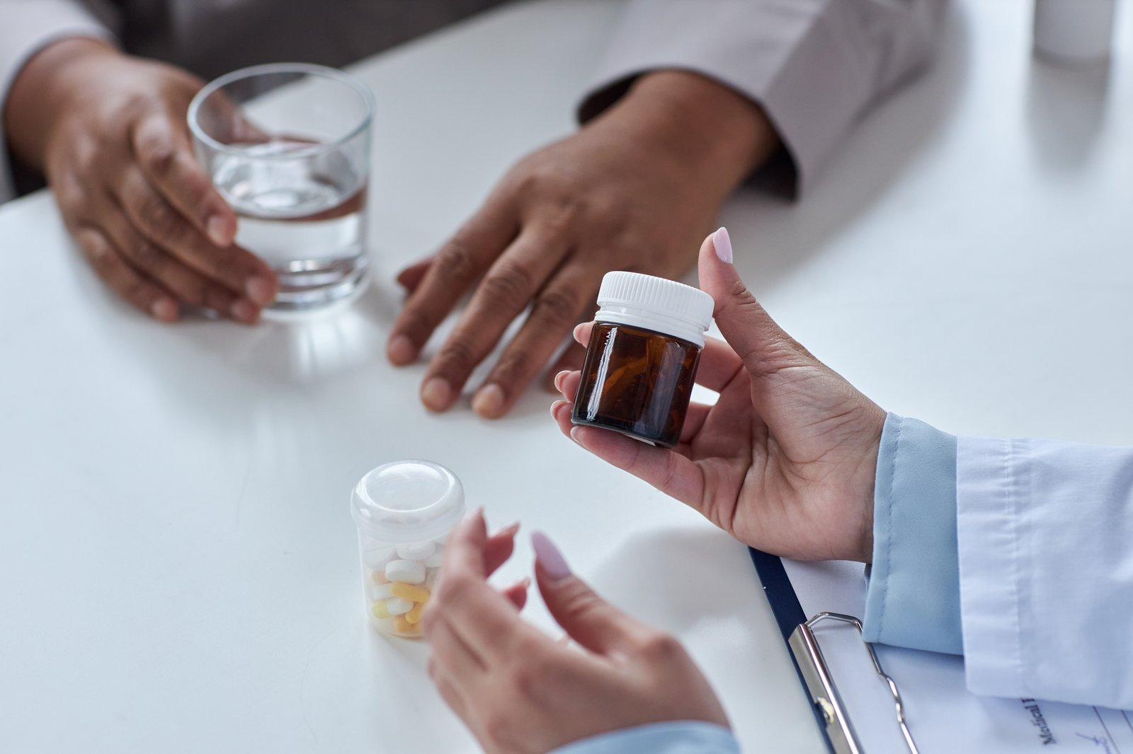 A pharmacist taking a call about a medication collection order