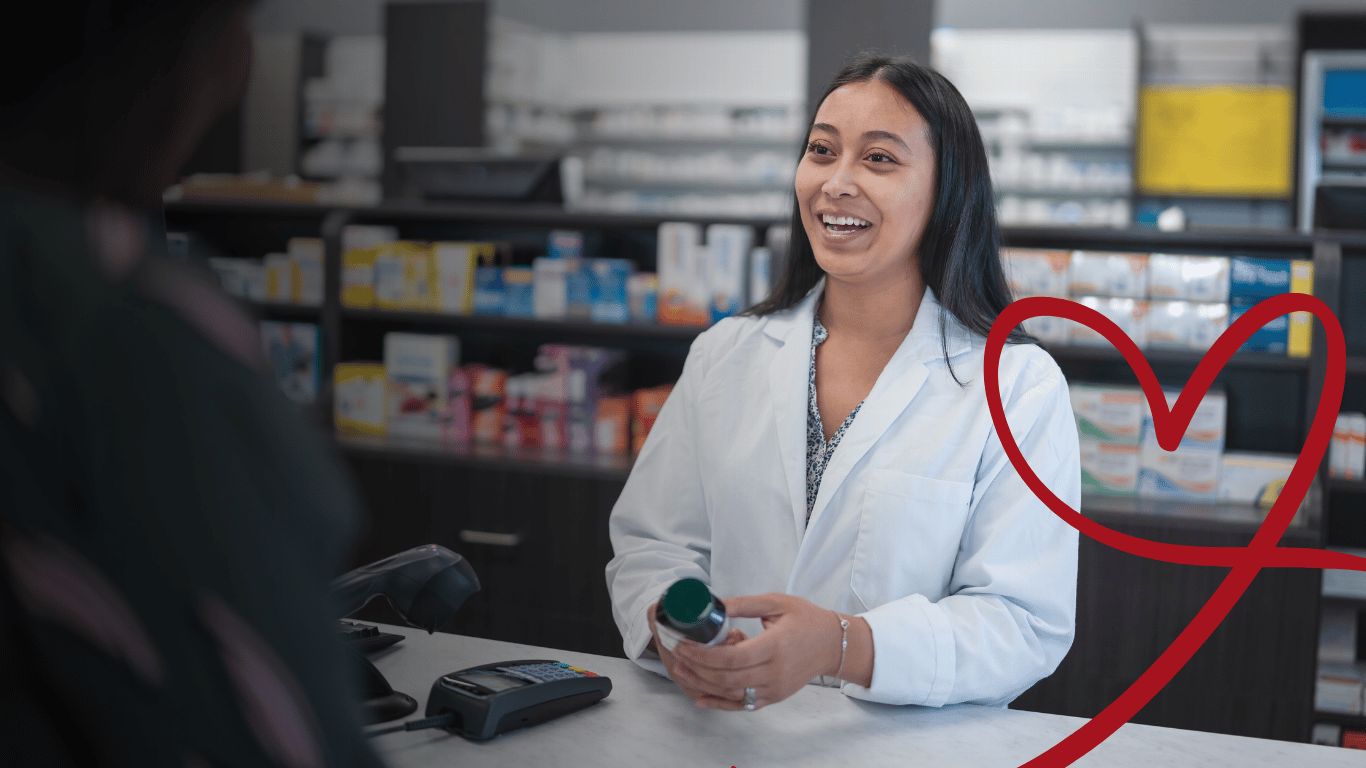 A pharmacist assisting a customer at the counter